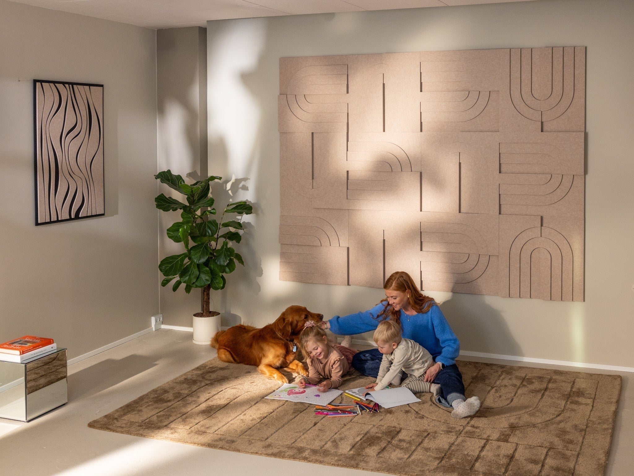Living room with family and dog, showcasing decorative acoustic panels that showcase the science of sound absorption.
